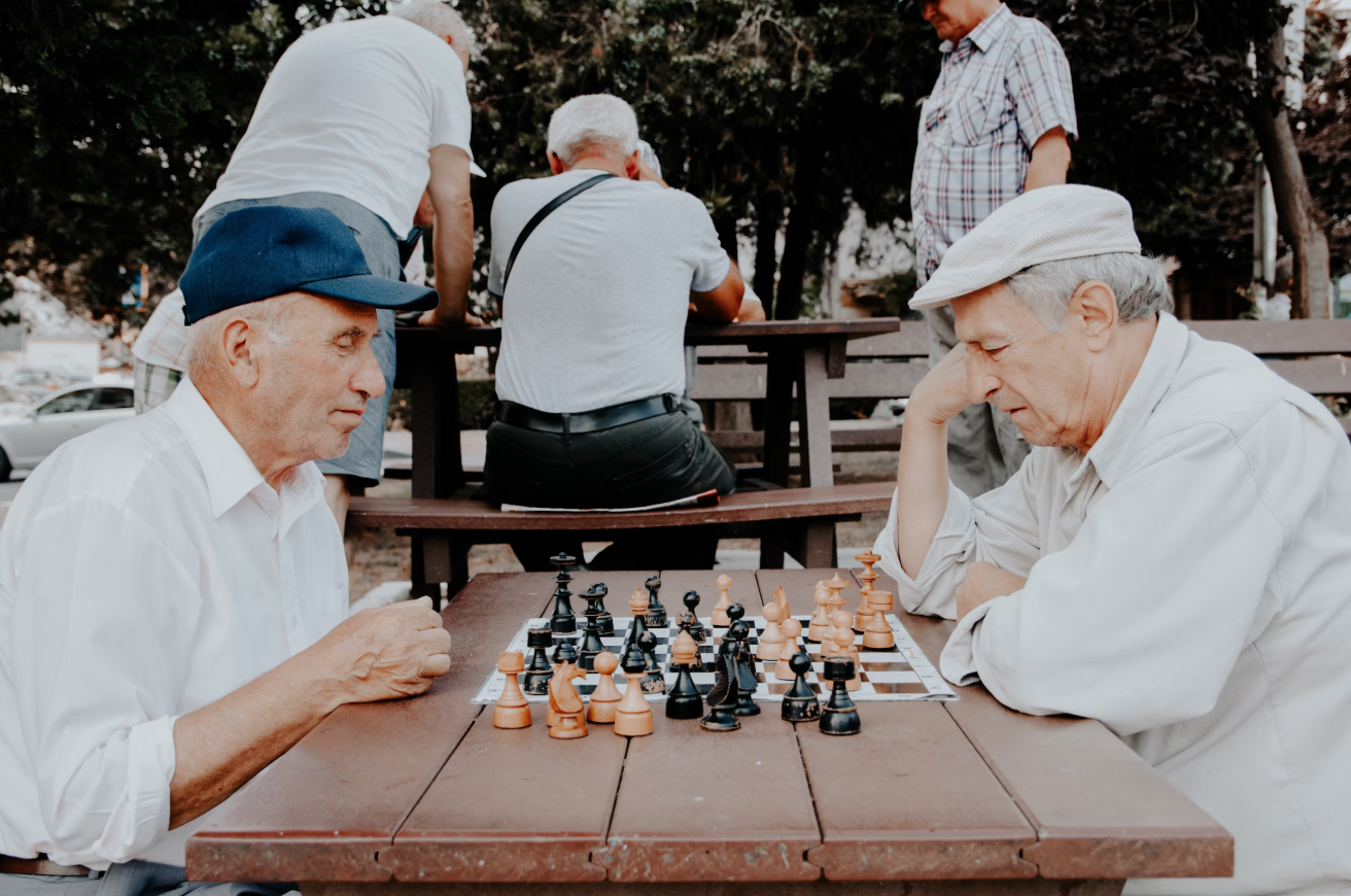 Two elderly men playing chess
